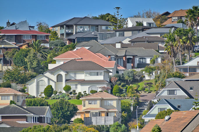 View of houses on Highland Park hill with colorful roofs.